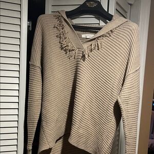 Elegant Tan V-Neck Sweater with Fringe